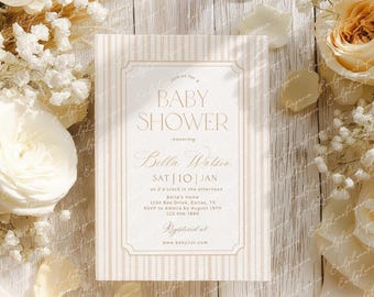 May include: A baby shower invitation with a cream and beige striped background. The invitation features the text "Baby Shower" in elegant script, along with event details. Floral accents surround the invitation.