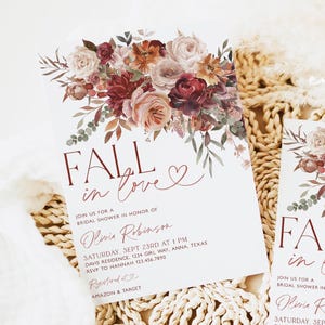 May include: Fall in love bridal shower invitation with a floral design in shades of pink, red, and orange. The invitation features the text "Fall in love" with a heart and the bride's name, Olivia Robinson. The invitation also includes the date, time, and location of the shower.