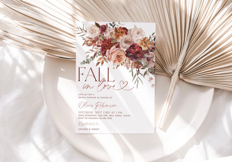 May include: Fall in love bridal shower invitation with a watercolor floral design in shades of red, orange, and pink. The invitation features the text "Fall in love" with a heart symbol and details for the event, including the date, time, location, and RSVP information.