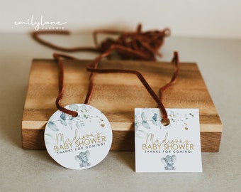 May include: Two baby shower favor tags with a watercolor eucalyptus design and a gold elephant illustration. The text on the tags reads "Madison's Baby Shower Thanks for Coming!"