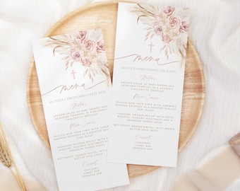 May include: A menu for Olivia's christening on December 3, 2022. The menu features a garden salad, grilled New York strip, French chicken breast, butternut squash ravioli, cupcakes, a candy bar, and an espresso bar. The menu is decorated with a watercolor illustration of a floral arrangement with a cross.
