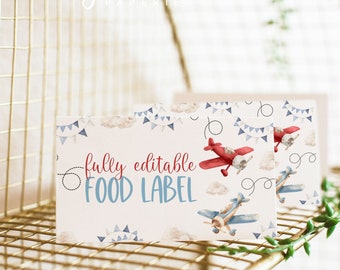 May include: Editable food label template with a red and blue airplane design. The label says "fully editable food label" and has a blue and white cloud background.