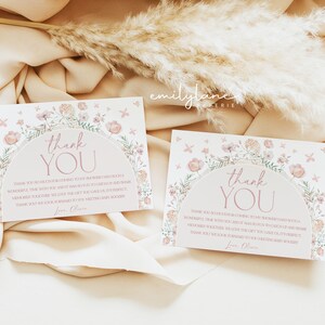 May include: Two pink and white floral thank you cards with a pink floral arch and the text "Thank You" in a pink script font. The text below the arch reads "Thank you so much for coming to my shower! I had such a wonderful time with you, and it was so fun to catch up and make memories together. We love the gift you gave us, it's perfect. Thank you, we look forward to you meeting baby [baby's name]. Love, Olivia."