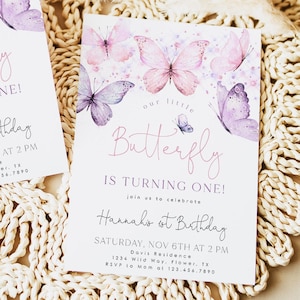 May include: A pink and purple butterfly-themed first birthday party invitation with watercolor butterflies and the text "Our little Butterfly is turning one! Join us to celebrate Hannah's 1st Birthday Saturday, Nov 6th at 2 PM Davis Residence 1234 Wild Way, Flower, TX RSVP to Mom at 123.456.7890"