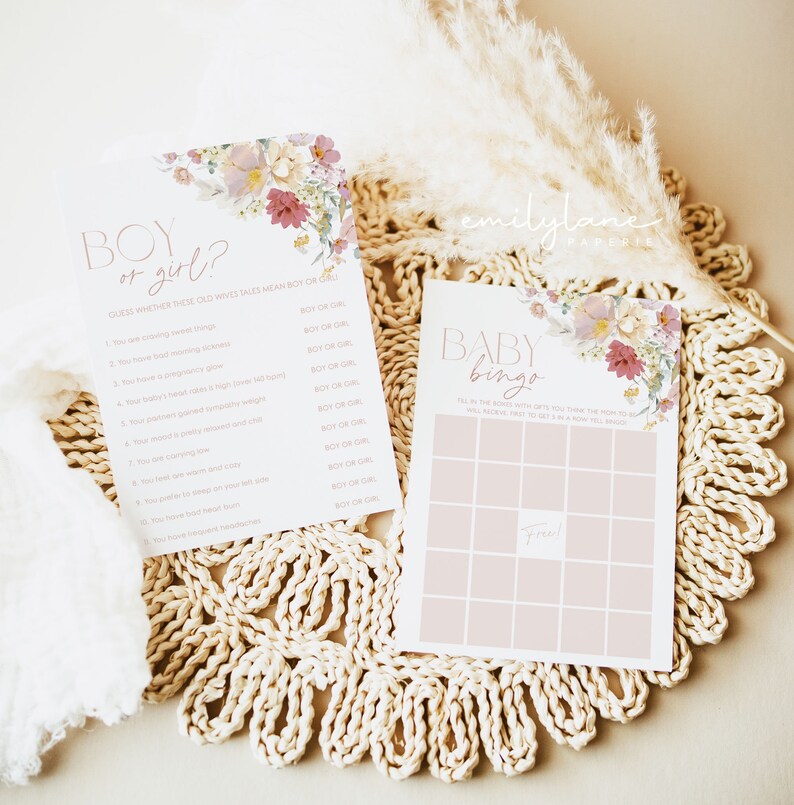 May include: Two printable baby shower game cards with a floral design. The first card is a "Boy or Girl?" game with a list of old wives' tales. The second card is a "Baby Bingo" game with a blank bingo card.