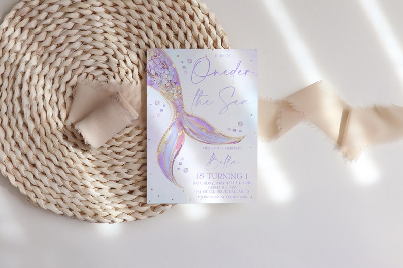 May include: Purple and gold mermaid tail illustration with the text "Oneder the Sea" and "Bella is turning 1".  The invitation is for a first birthday party.