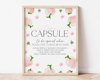 May include: A white printable sign with pink peach illustrations and the text "Time Capsule to be opened when Penelope turns 18 in 2039. Please write a message for Mason. Make a prediction or share your hopes and wishes. Don't forget to sign your name!"