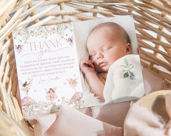 May include: A pink and green thank you card with a floral design and fairies. The card says "Thank you coming to my party and celebrating my birthday. I hope you had as much fun as I did and thank you so much for my present! I absolutely love it and can't wait to play with it! Love, Camilla". A baby is sleeping in a basket with a pink blanket.