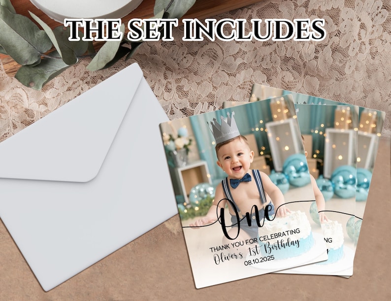 May include: A set of party invitations and envelopes. The invitations feature a baby wearing a crown and the text "One" and "Thank you for celebrating Oliver's 1st Birthday 08.10.2025". The envelopes are white.