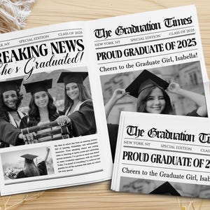 May include: Newspaper-style graduation announcements with the headline "Breaking News She's Graduated!" and "Proud Graduate of 2025." Black and white photos of graduates in caps and gowns are featured. The announcements are on a wooden surface.