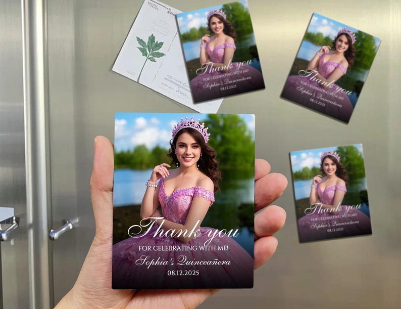 May include: Rectangular magnets with a photo of a woman in a pink dress and a tiara. The magnets have the text "Thank you for celebrating with me! Sophia's Quincea&ntilde;era 08.12.2025". The magnets are held in a hand.