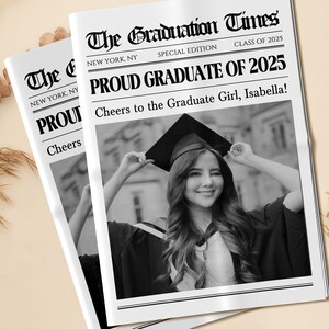 May include: Two newspapers titled "The Graduation Times" with the headline "Proud Graduate of 2025." The newspapers feature a black and white photo of a smiling graduate in a cap and gown. The text reads "Cheers to the Graduate Girl, Isabella!"