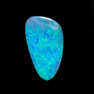 May include: A polished opal gemstone with a teardrop shape. The stone displays a vibrant play of color, with swirling patterns of blue and green against a translucent background. The opal is set against a black backdrop.