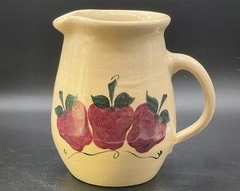 Two quart vintage pottery pitcher with three apples