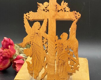 Handcrafted wooden Crucifix with angels and cherubs.