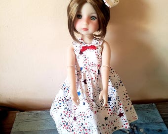 Beautiful star dress and bow for 15 inch doll.