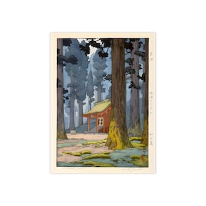 May include: A Japanese woodblock print depicting a serene forest scene. Tall, slender trees frame a small, red shrine with a yellow roof. The artwork uses muted blues, greens, and browns to create a tranquil atmosphere. The print is a landscape illustration.