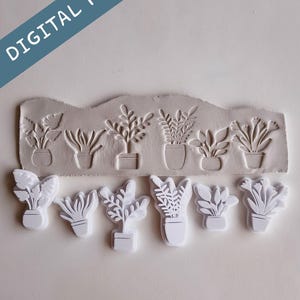 May include: A collection of white plant-shaped cookie cutters and a matching clay impression. The cutters and impression feature various potted plant designs. The image includes the text "DIGITAL FILE" in a blue banner.