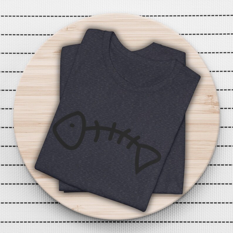 May include: A dark blue t-shirt with a simple black fishbone design.