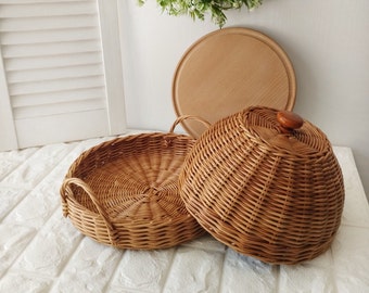 A set of three items for serving and storing food. Wicker tray with lid + wooden board.Storage in the kitchen