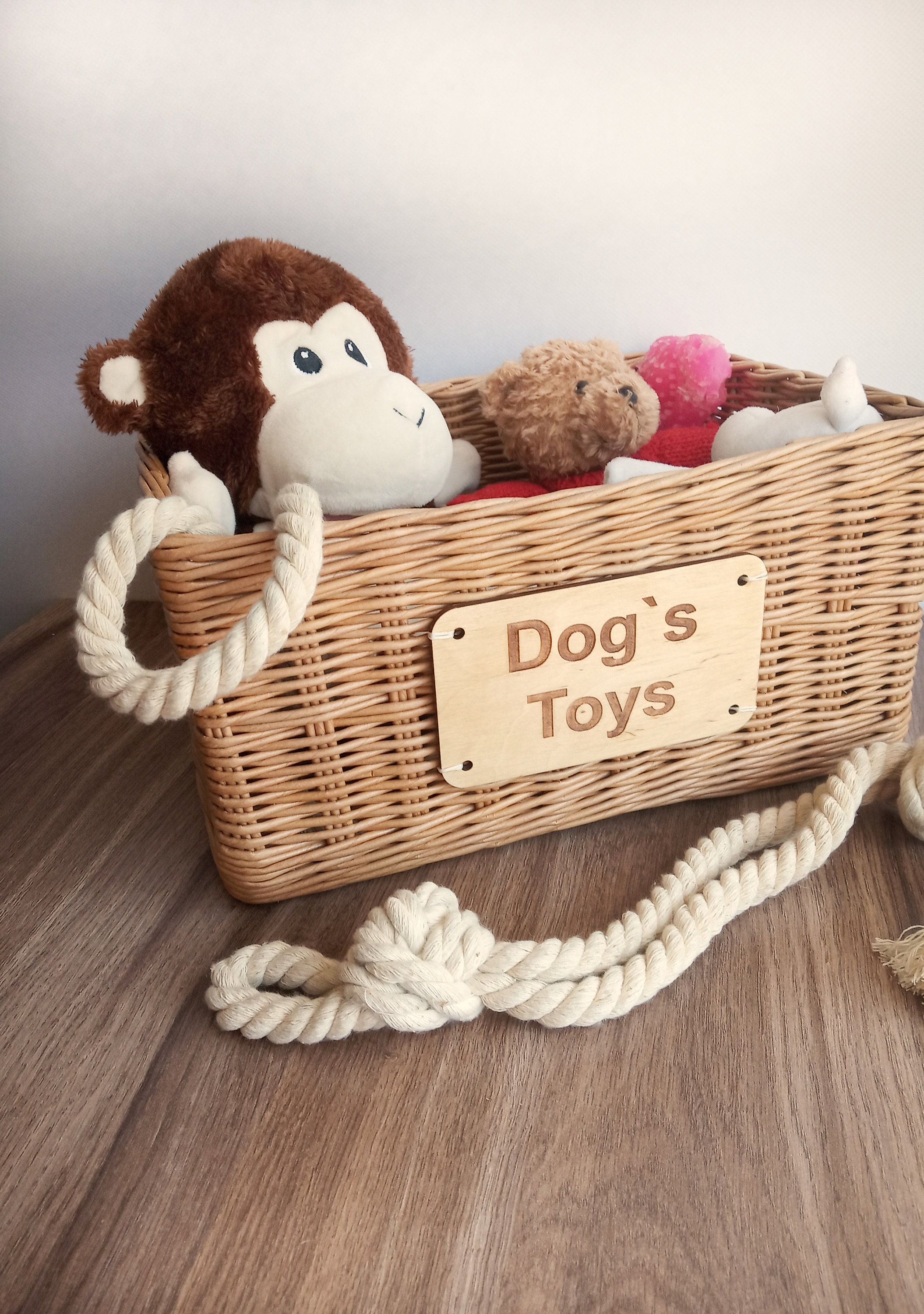 Storage basket for dog toys. Personalized basket with toys for the