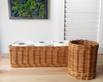 Set of two bathroom baskets. A wicker rectangular basket for toilet paper and a small round one for small items. Toilet paper holder.
