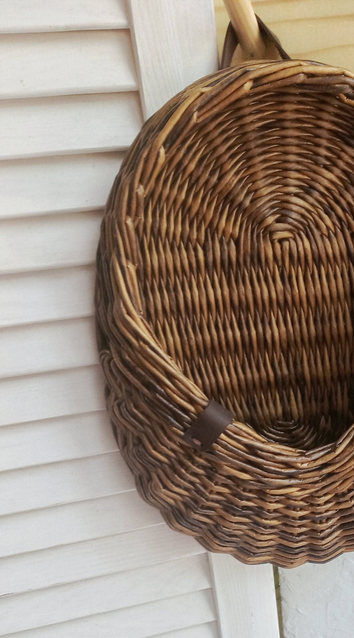 A small wicker hanging basket with a flat back wall can be Etsy