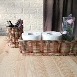 Set of two bathroom baskets. A wicker rectangular basket for toilet paper and a small round one for small items. Toilet paper holder. 11