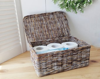 Rectangular toilet paper bin with lid in the bathroom. Storage basket.