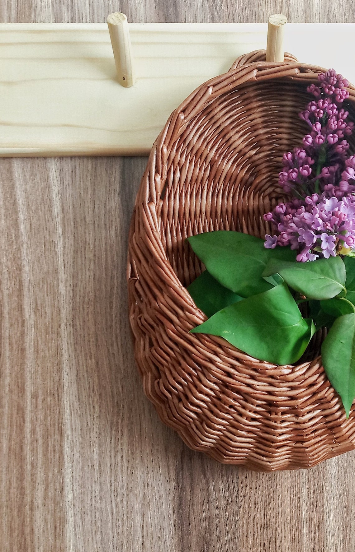 A small wicker hanging basket with a flat back wall can be Etsy