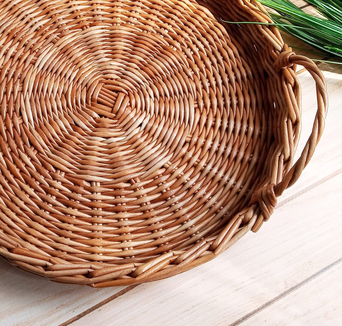 Small round wicker tray with handles for a coffee table. Nice Etsy