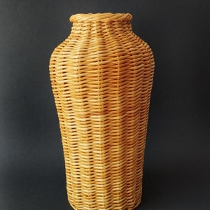 Wicker vase for flowers. Basket for artificial or dried flowers. Decorative jug for home decoration. 1