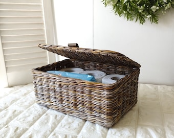 Rectangular toilet paper bin with lid in the bathroom. Storage box. Сosmetic storage basket.