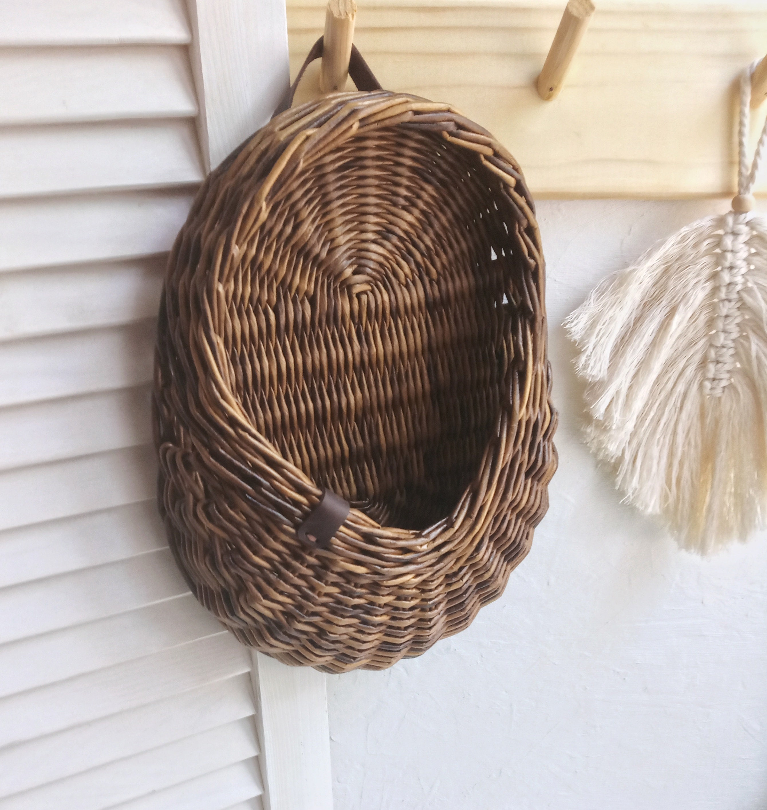 A small wicker hanging basket with a flat back wall can be Etsy