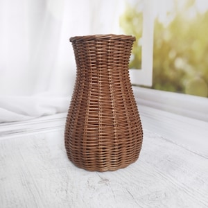 Wicker vase for flowers. Basket for artificial flowers or dried flowers. Decorative jug for home decoration. Photo props for home. image 2