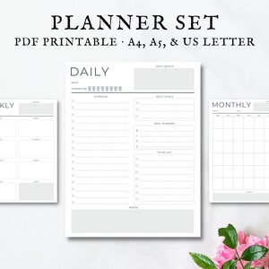 May include: Printable planner set in black and white with a weekly, daily, and monthly layout. The daily planner includes sections for daily quotes, daily goals, meal planner, and to-do list.
