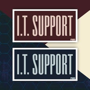 May include: Two white-bordered stickers with the text "I.T. SUPPORT" in black and white lettering on a brown and blue background.