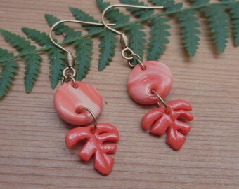 Orange monstera leaf dangling earrings, in polymer clay