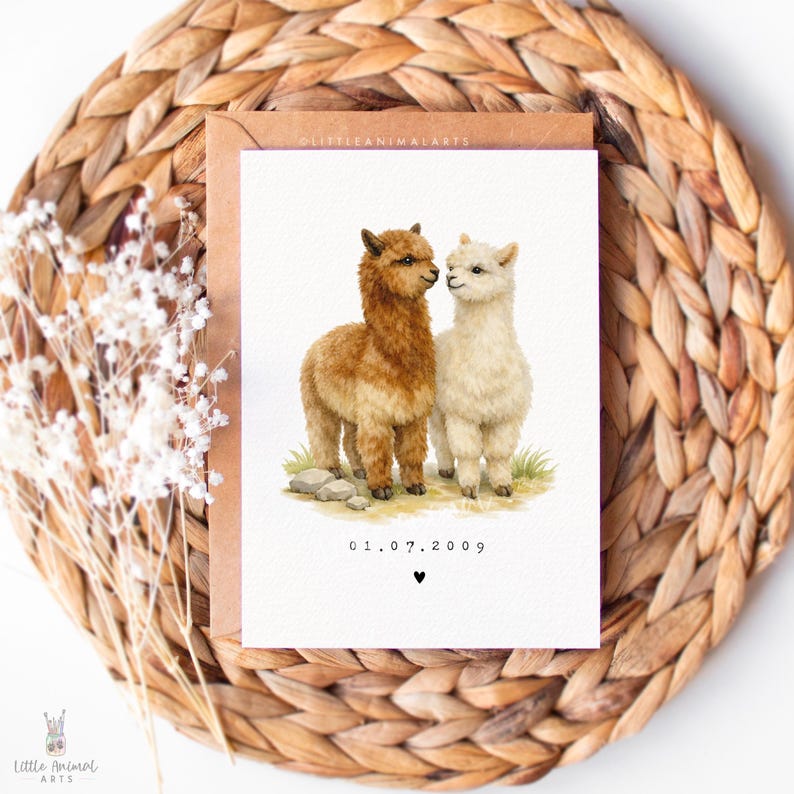 Personalised alpaca couple anniversary card with custom date, romantic animal greeting card for husband, wife or partner, wedding date keepsake card featuring two alpacas in love, luxury fine art printed card on textured cardstock with kraft envelope, cute animal couple illustration for anniversary gift, relationship card, wedding memory card, unique personalised love card for her or him.