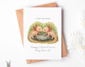 May include: A Valentine's Day card featuring two axolotls, with the text "I Love You Alotl" and "Happy Valentines Day David". The axolotls are pink with feathery gills, set against a green and gray background. The card is on a brown envelope.