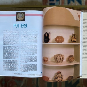 May include: A close-up of a shelf displaying a collection of Pueblo pottery. The pottery is made in various colors and patterns, including black, white, and brown. The pottery is arranged in a decorative manner on the shelf, which is made of wood and has a light brown finish.