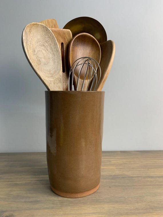 A handcrafted extra-tall Japandi ceramic utensil pot that doubles as a sculptural countertop object — form AND function with a real aesthetic point of view.