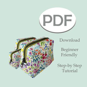 May include: Three floral print zippered pouches in varying sizes. The pouches have black zippers with green trim. The image includes the text "PDF", "Download", "Beginner Friendly", and "Step-by Step Tutorial".