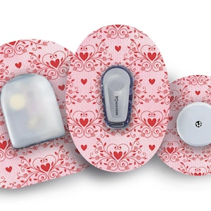May include: Three round adhesive patches with a pink and white background and a red heart pattern. The patches are designed for a medical device. The text "Medtronic CGM" is visible on one of the patches.