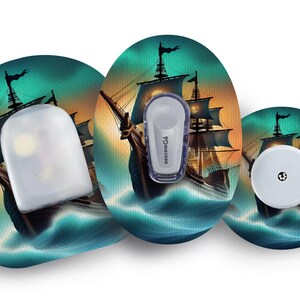 May include: Medical device accessories with a pirate ship illustration. The set includes a sensor, transmitter, and adhesive patches. The patches have a teal and orange background with a ship sailing on the sea. The transmitter is labelled "Dexcom G6".