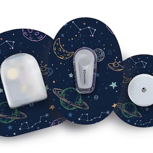 May include: Three round, adhesive patches with a space-themed design. The patches are blue with white stars, planets, and a UFO. The text "FreeStyle Libre" is printed on one of the patches.