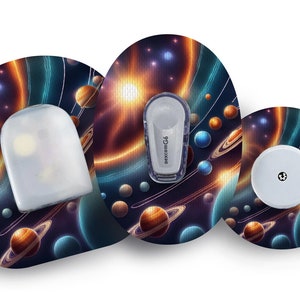 May include: Three round, colorful, adhesive patches with a space-themed design. The patches feature a galaxy background with planets, stars, and swirling nebulae. The patches are designed to cover medical devices.