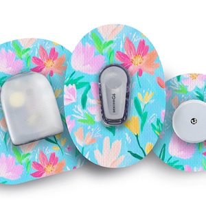 May include: Three medical devices with a floral pattern. The devices include a sensor, a transmitter with the text "dexcom G6", and a receiver. The background is light blue with pink, orange, and yellow flowers.