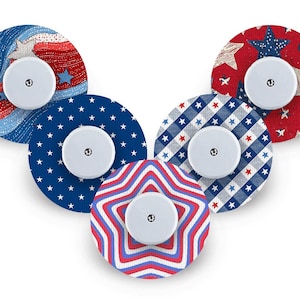 May include: Five circular decorative covers with white central components, each displaying a different patriotic design. The patterns include stars, stripes, and plaid in red, white, and blue. These covers are likely for a medical device.
