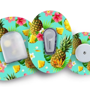 May include: Three round medical device patches with a tropical pineapple and hibiscus flower design on a turquoise background. The patches are for a continuous glucose monitor.
